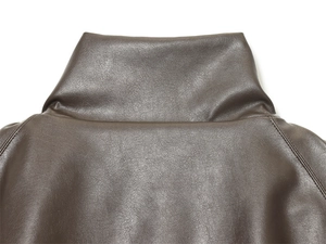 Detailed view of deep brown PU leather jacket collar and premium stitching textures