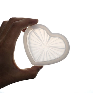 Macro detail of translucent heart silicone mold with fine internal striped texture