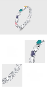 Detailed macro view of S925 sterling silver ring with colorful enamel heart patterns