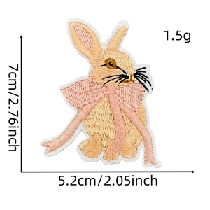 Detailed view of rabbit embroidery patch with exact dimensions 7cm by 5.2cm shown on scale