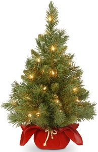 Mini Christmas tree with red velvet base and warm LED fairy lights for tabletop decor