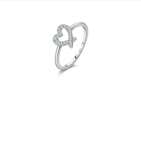 Detail of S925 sterling silver stamp on an irregular heart-shaped pavé diamond ring