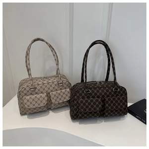Detail of retro geometric pattern tote bags with double front pockets and zip closure