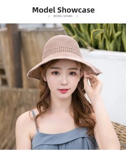 Close-up of pink crochet sun hat featuring hollow breathable stripes and bow detail