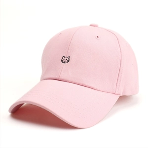Close-up of cute cat embroidery on pink cotton baseball cap with twill texture detail