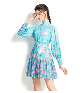 Detail shot of the stand collar and button-down front on the floral puff sleeve dress