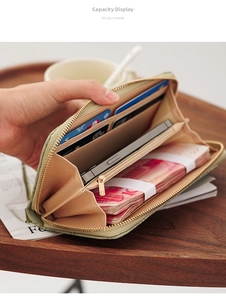 Macro view of long zipper wallet interior with multi-card slots and large phone compartment