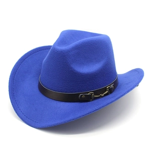 Detail of royal blue felt cowboy hat with brown leather belt buckle and metal horse bit