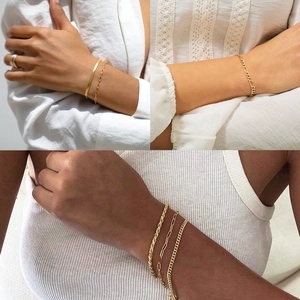 Detail view of gold-plated titanium steel chain bracelet set featuring various styles