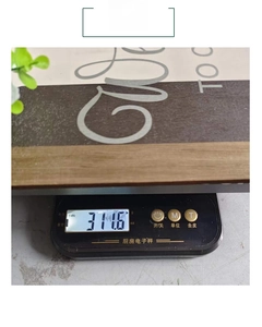 Close-up showing a 311.6g weight measurement of a rustic wooden door sign decoration