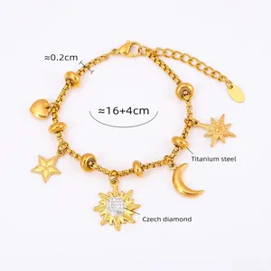 Detail showing 18k gold plated titanium steel bracelet with sun and moon charms