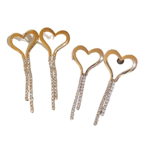 Elegant gold hollow heart earrings with dangling rhinestone tassels in a stylish design