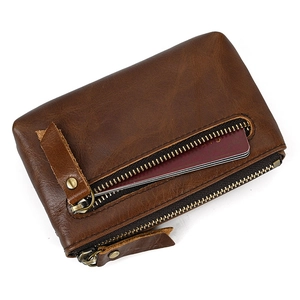 Detailed view of brown genuine leather coin purse showing premium crazy horse texture