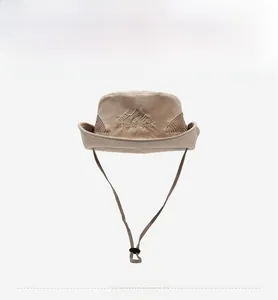 Detailed front view of khaki outdoor hat featuring mountain embroidery and mesh panels