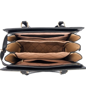 Minimalist large capacity crossbody bag showing internal multi-layer structure and gold zippers