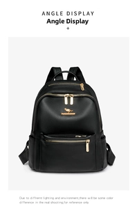 Detail of black lychee leather backpack with golden kangaroo logo and metal zipper
