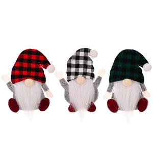 Three Christmas faceless gnome cutlery holders in red, white and green plaid fabrics