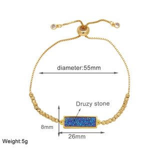 Detail view of gold-plated bar bracelet with blue Druzy stone and dimension annotations
