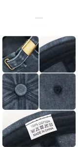 Macro detail of navy washed cotton skull cap showing metal buckle and 100% cotton inner tag