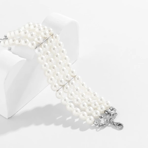 Detail of four-layer pearl bracelet with silver spacers and adjustable lobster clasp