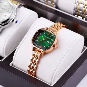 Macro detail of rose gold quartz watch featuring a green dial with luxury crystal markers