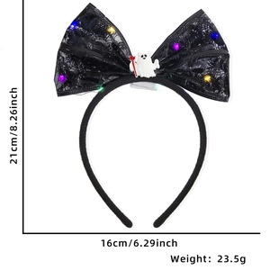 Detailed view of LED Halloween headband with glowing lace bow and small ghost charm