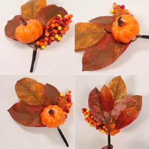 Detail of artificial autumn pick with orange pumpkin, maple leaves and colorful berries