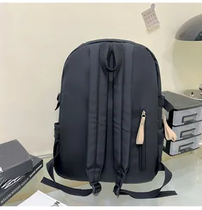 Detail view of the black backpack back panel with padded straps and hidden anti-theft pocket