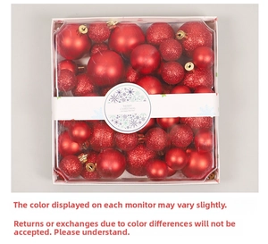 Top view of red Christmas ball set with matte and glitter finishes in clear square box