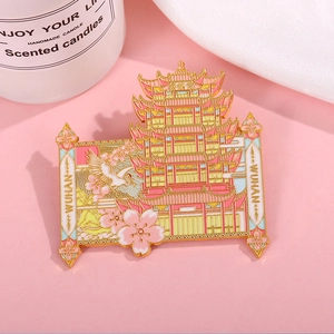 Detail of metal Wuhan Yellow Crane Tower fridge magnet with cherry blossoms and crane