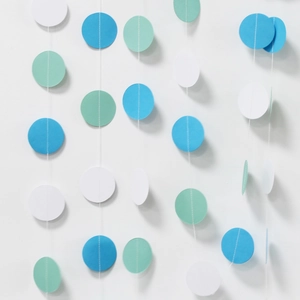 Blue, green, and white glitter heart and round paper garlands for party decoration