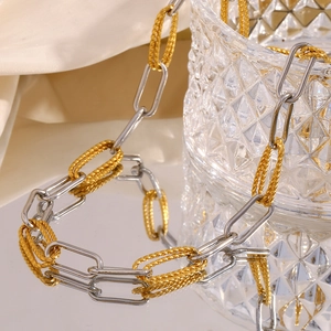 Detail view of 18K gold-plated paperclip and silver twisted rope combination chain