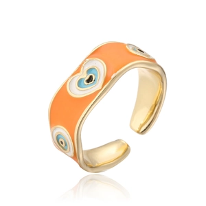 Close-up of 18K gold plated open ring featuring orange enamel and evil eye pattern