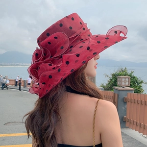 Women's red polka dot organza sun hat with large floral detail for beach vacations