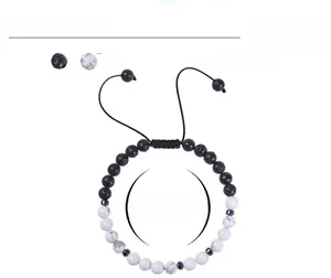 Detail of adjustable Morse code bracelet featuring 6mm volcanic and white howlite beads