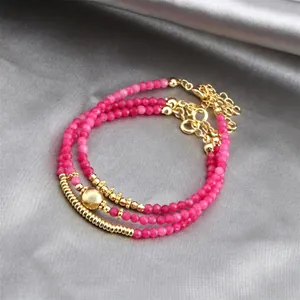 Three-piece stackable bracelet set with pink carnelian beads and gold-plated accents