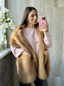 Detail view of brown faux fox fur scarf shawl with convenient side pockets for women