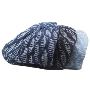Three denim newsboy caps in varied blue tones with white leaf jacquard patterns