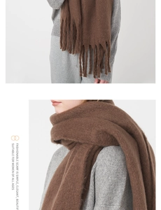 Close-up of thick mohair scarf showing soft fuzzy texture and long tassel details
