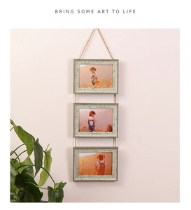 Hanging 3-frame photo display with rustic wood frames and natural hemp rope details