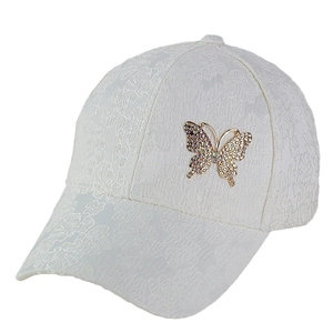 White lace baseball cap featuring a decorative rhinestone butterfly for outdoor sun protection