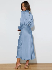 Detail of elegant dusty blue satin halter dress back with smooth draping fabric