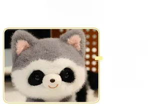 Close-up of the plush raccoon head showing soft gray fur and embroidered smile detail