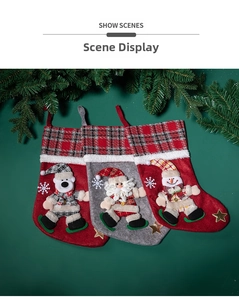 Three Christmas stockings with Santa, snowman and bear plaid designs on green background