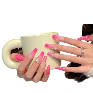 Extra long pink ombre press-on nails with 3D white flowers and sparkling silver rhinestones