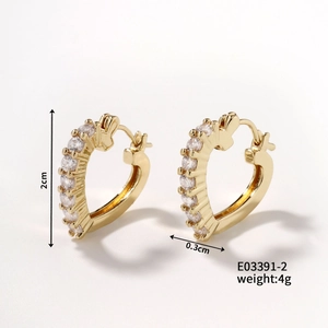 Detail view of heart-shaped gold-plated hoop earrings with cubic zirconia and size specs