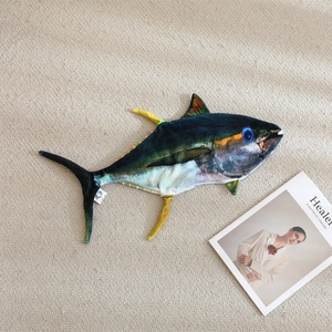 Realistic tuna fish plush pillow on a cozy woven rug with high-quality scales and fins detail