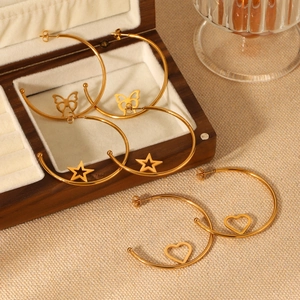Golden C-shaped stainless steel hoop earrings with butterfly star and heart charms