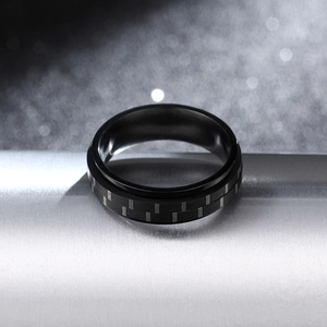 Minimalist 6mm black stainless steel ring with carbon fiber inlay and rotating design