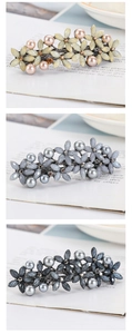 Detailed view of floral hair clips with pearls and crystals in three color variants